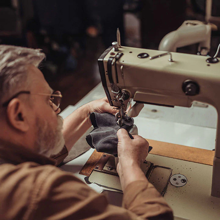 Craftsman at work with sewing machine
